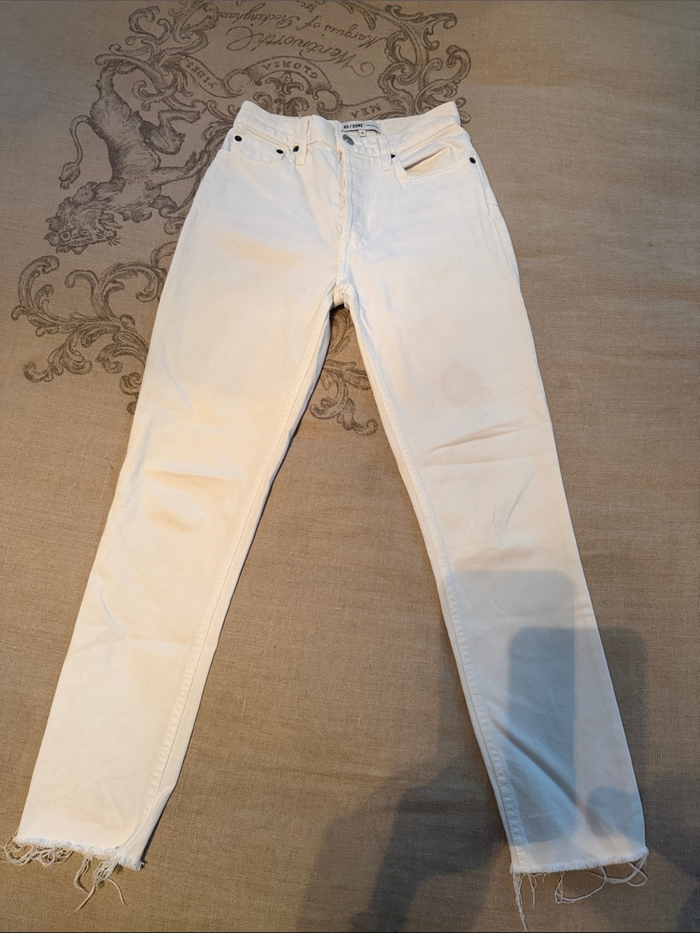 RE/Done White High-Rise Straight frayed originals jeans.